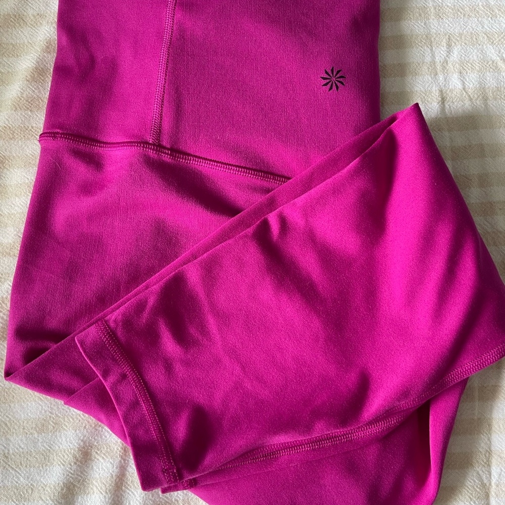 Athleta ultra high rise elation 7/8 good condition has two small black stains